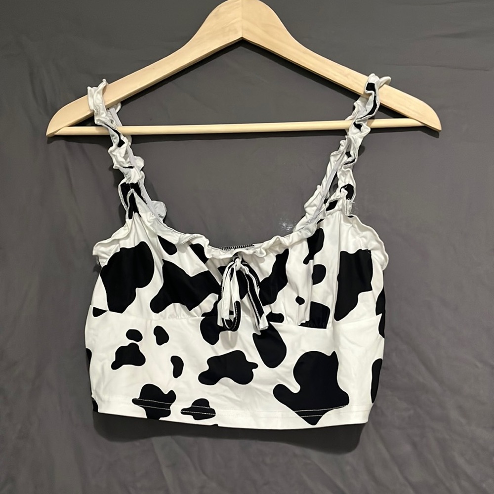 MOO! This cow print tank-top is a must have for animal print lovers 🐄